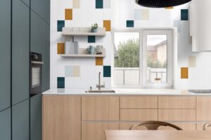 Modern kitchen with colorful subway tiles from Pure by Sonoma Tilemakers Modern and bright kitchen with minimalist cabinetry and colorful subway tile.