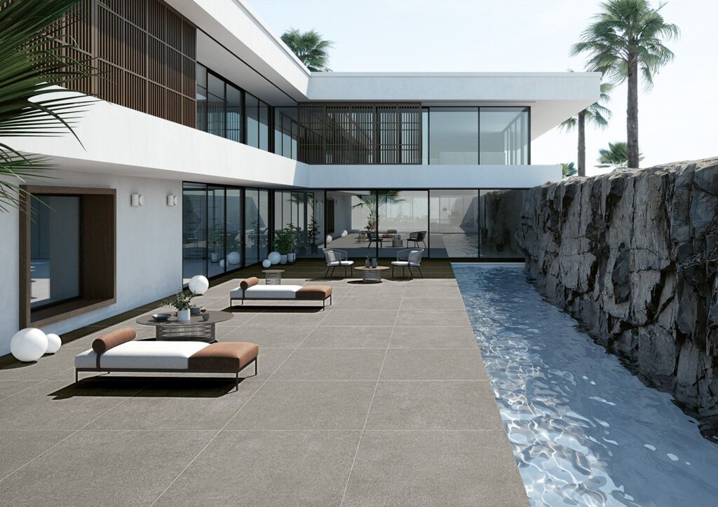 Outdoor oasis with sun chairs and concrete tile