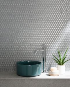 sink, plant, and soaps in front of Adex USA tile backsplash