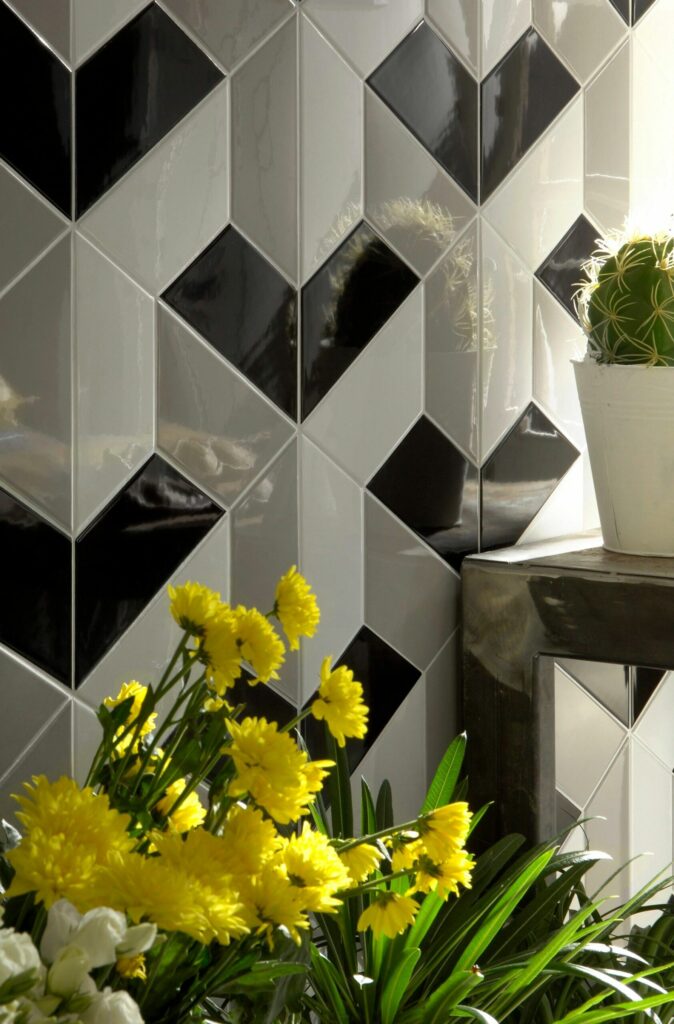 black, white, and grey half hexagon tile geometric backsplash