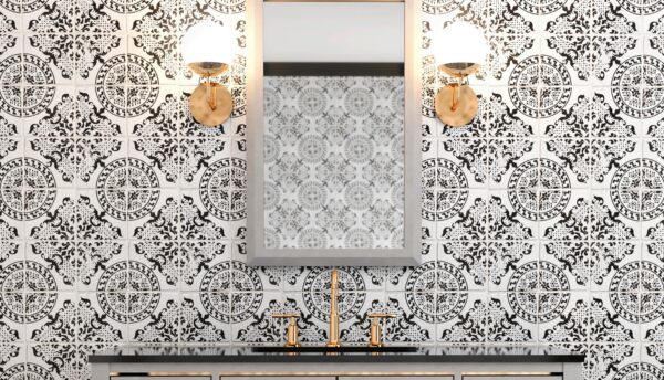 A bathroom with antique style tiles and gold accents