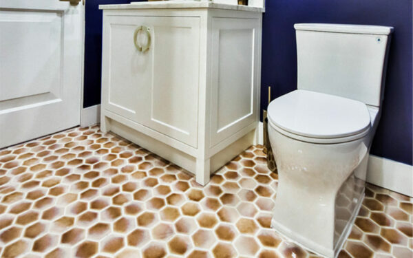 Brown and white hexagonal floor tiles in a bathroom