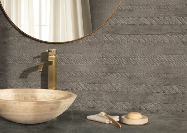 Stone bowl sink with a tile backsplash