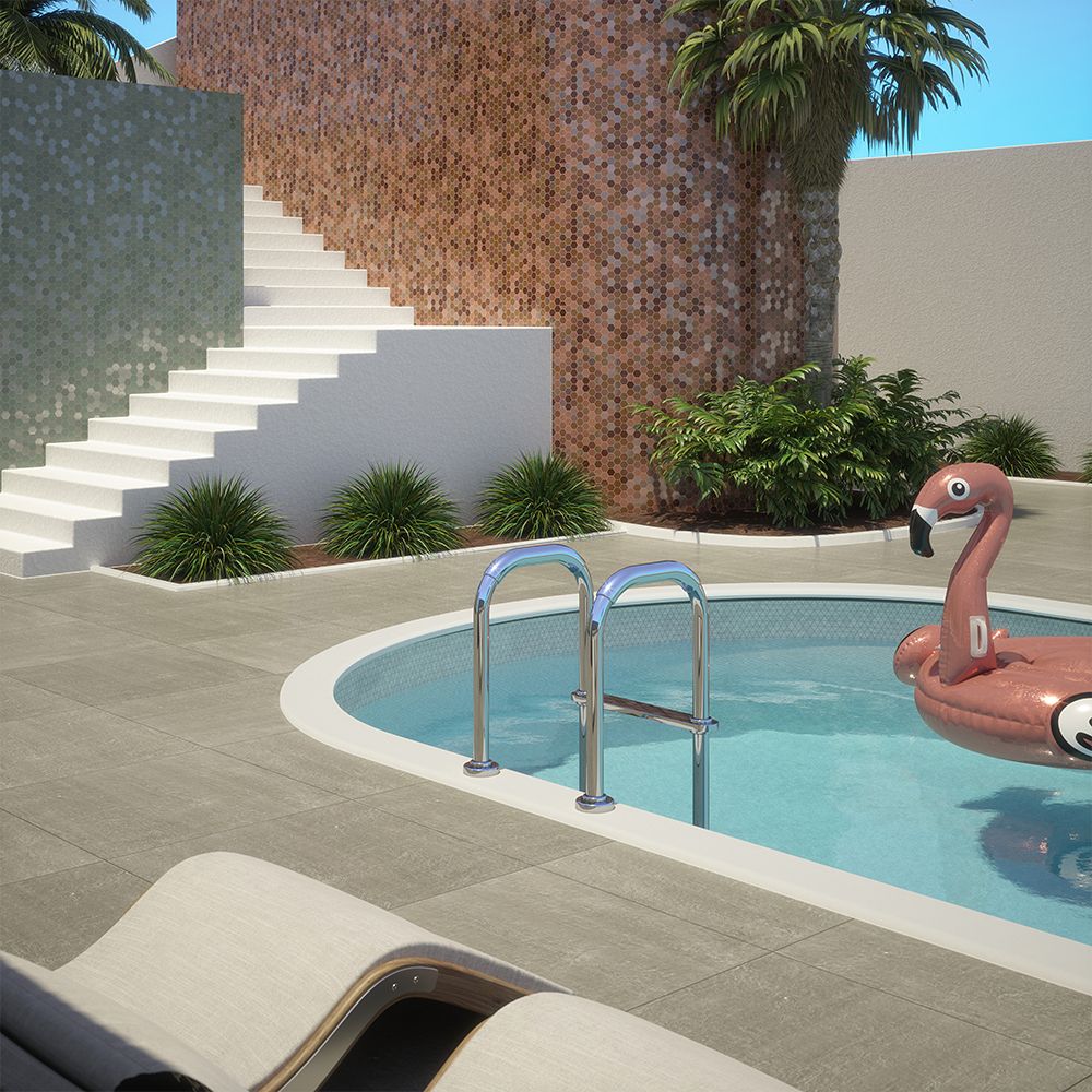 Sunny day with flamingo pool floatie floating on top of porcelain tiled pool